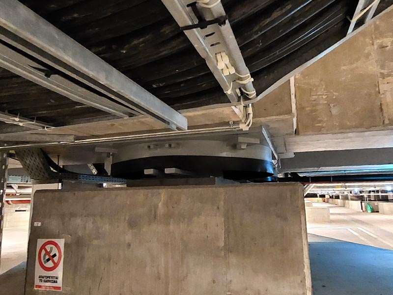 Seismic base isolator in reinforced concrete structure