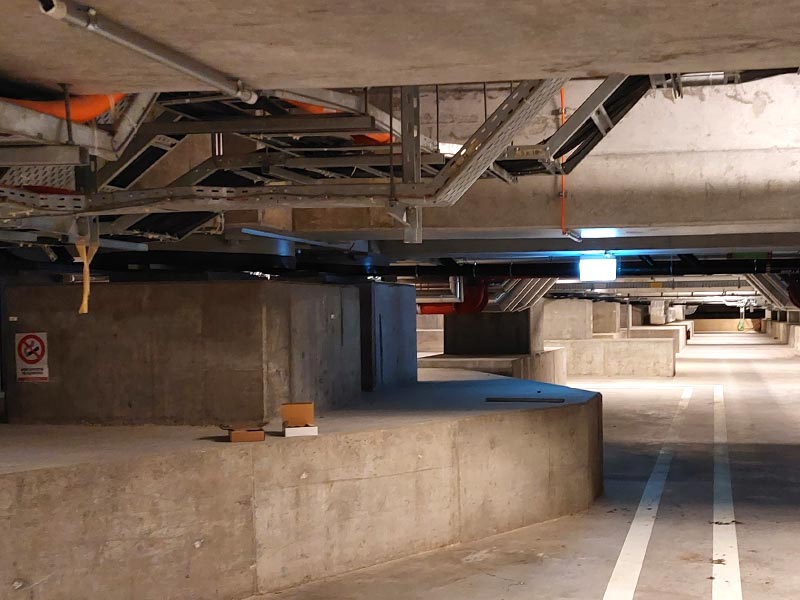 Seismic base isolator in reinforced concrete structure